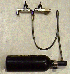 Paint ball bottle with filler pipe taps