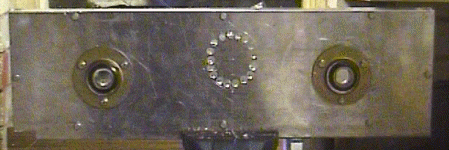 A number of holes are drilled along the perimeter of the hole