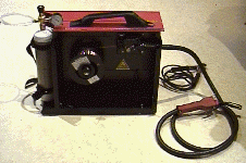 Side view of MIG welder showing wire drum and feeder mechanism