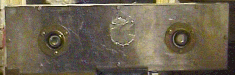 The metal is cut between the holes